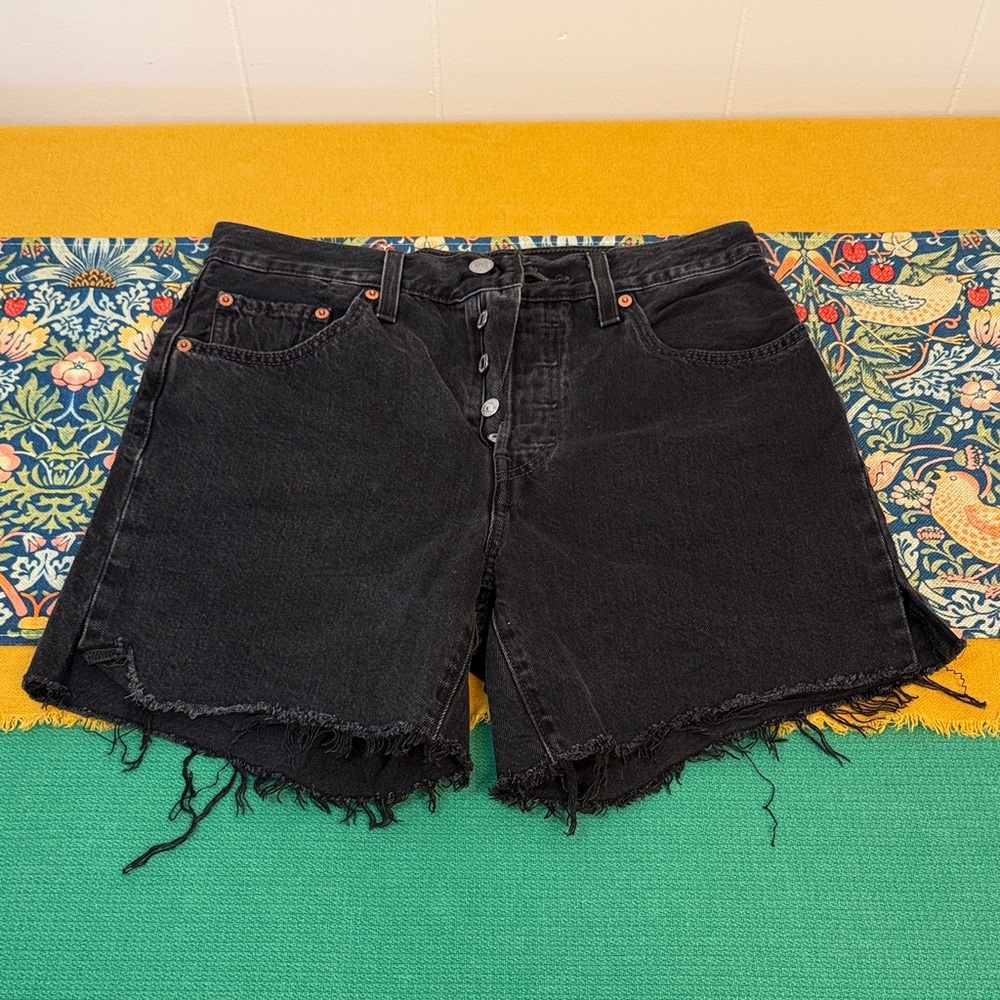 Levi’s 501 distressed black shorts